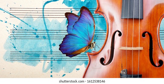 Butterfly, violin and notes. Blue morpho butterfly and violin. Melody concept. Photo of old music sheet in blue watercolor paint. Classical music concept. Violin close up. copy spaces