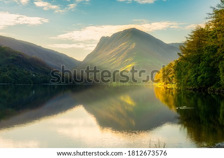Buttermere lake in misty morning light. Lake District. England