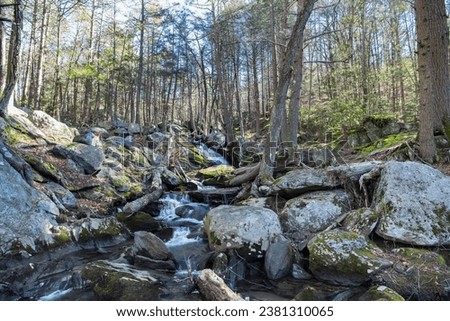 Buttermilk Falls and Hancock Brook in Plymouth Connecticut on a sunny winter day.
