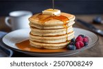 Buttermilk Pancakes: Fluffy, golden pancakes made with tangy buttermilk, perfect for soaking up butter and maple syrup at breakfast.