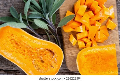 butternut squash over old wood background - Shutterstock ID 226222594