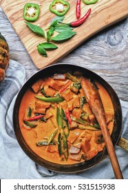 Butternut Squash/ Pumpkin In Authentic Thai Red Curry Coconut Sauce With Red And Green Chilies. Serve With Grilled Cashew Nut In A Butternut Squash Bowl. 