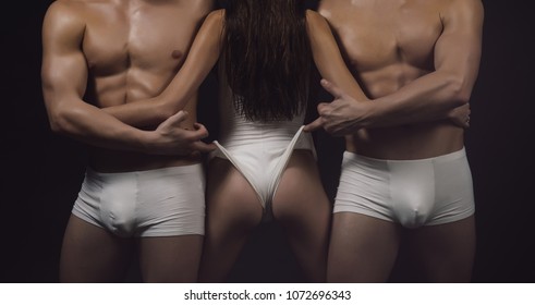 buttocks of sexy young woman at macho men. buttocks of sport woman in white sportswear