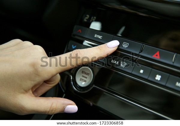 button\
of heating of mirrors and rear window of the\
car