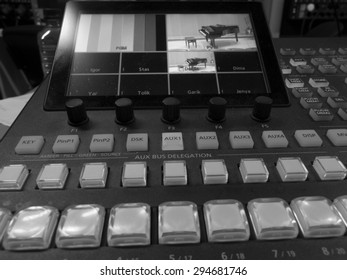 button on the control panel television equipment. black and white photo 