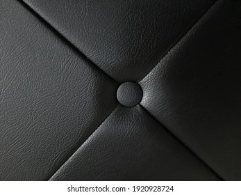 the button on leather surface