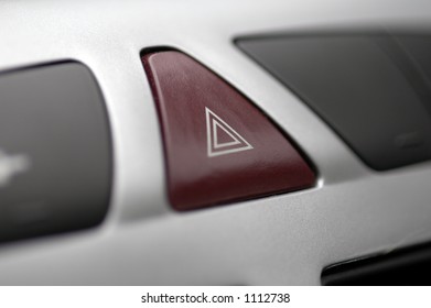 A Button On A Modern Car Dashboard To Activate Hazard Lights