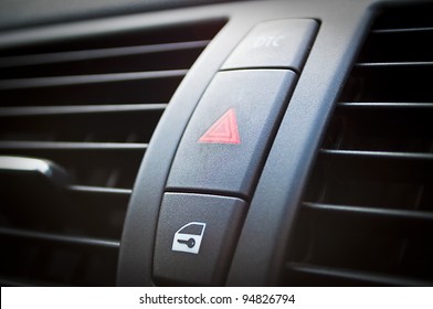 A Button On A Modern Car Dashboard To Activate Hazard Lights