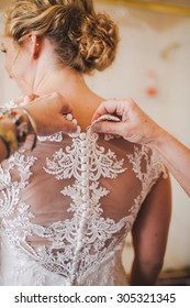 Buttoning Bride's Vintage Wedding Dress