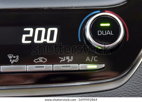 buttons to activate the air conditioning in the car\
and the temperature\
gauge