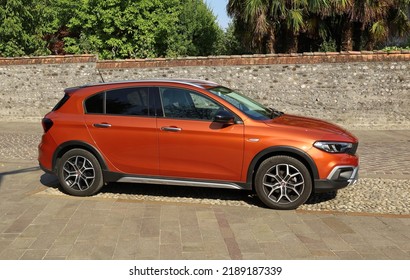 Buttrio, Italy, August 8, 2022. Fiat Tipo Cross, The New Hatchback Of The Italian Automaker, In The Street Of The Old Village	