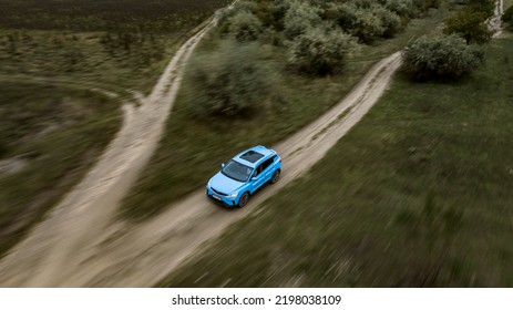 Butuceni, Moldova - 09 03 2022: Aerial Shot With Motion Blur Blue Geely Coolray On Off Road