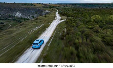 Butuceni, Moldova - 09 03 2022: Aerial Shot With Motion Blur Blue Geely Coolray On Off Road