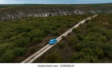 Butuceni, Moldova - 09 03 2022: Aerial Shot With Motion Blur Blue Geely Coolray On Off Road