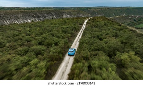 Butuceni, Moldova - 09 03 2022: Aerial Shot With Motion Blur Blue Geely Coolray On Off Road