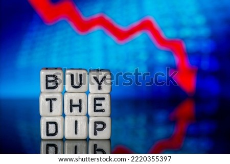 Buy The Dip Concept Dice Letters Red Arrow Down Blue Background