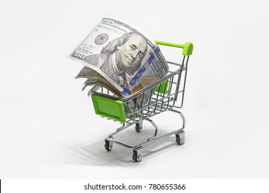 Buy Foreign Currency. Purchase Of Banknotes 100 Dollar. Shopping Basket With Dollar Bank Notes, Bills Isolated On White Background