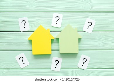 Buy House With House Figure And Question Mark On Office Desk Mint Green Wooden Background Top View