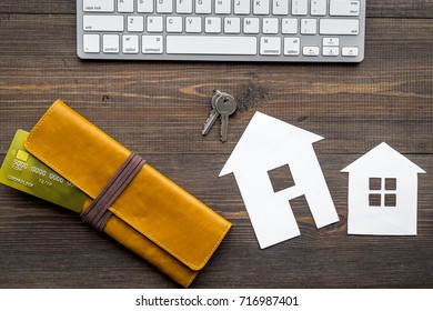 Buy House Online With Paper Figures And Keys On Office Desk Wooden Background Top View