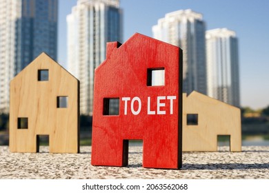 Buy To Let Concept. Small Wooden Houses.