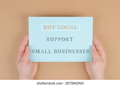 Buy Local, Support Small Businesses, Enviromental Shopping, Text On Paper, Lrown Background, Phrase, Hands Hold Message