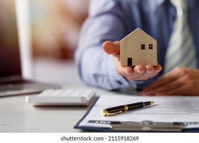 buy or sell real estate mortgage, Sale representative offer house purchase contract to buy a house or apartment and mortgage Money and Financial Concepts - Shutterstock ID 2115918269