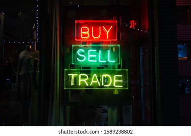 Buy Sell Trade Neon Sign At Night