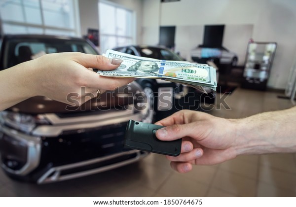 the buyer gives money to buy or rent a new car.\
concept of a successful\
deal.