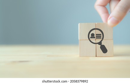 Buyer Persona And Target Customer Concept. Buyer Or Customer Psychology Profile Or Characteristics. Marketing Analysis For Business Plan. Hand Holds Wood Cubes With Person Data, Magnifying Glass. 