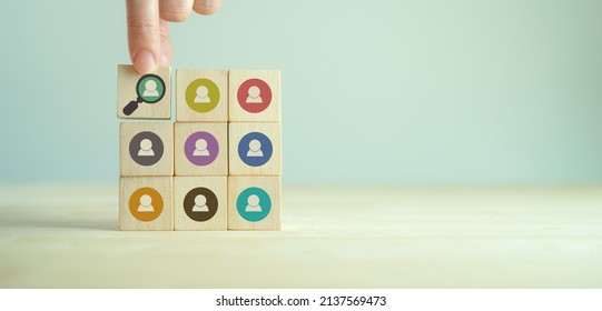 Buyer persona and target customer concept. Customer psychology profile or characteristics. Personalized marketing. Customer analysis for marketing plan. Hand holds wood cubes with buyer persona icons.