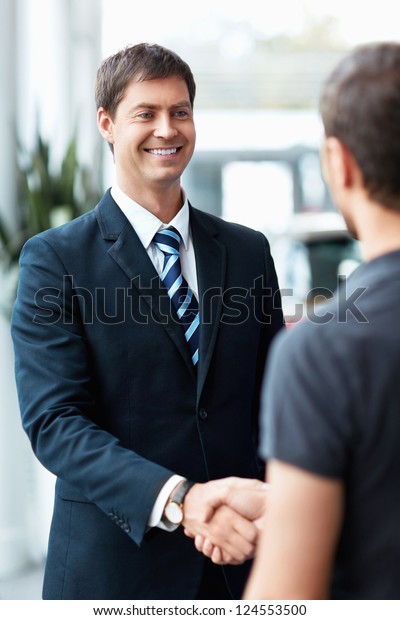 Buyer and seller shake\
hands