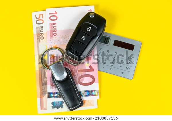 Buying a\
car, euro money and car keys. Loan\
payment.