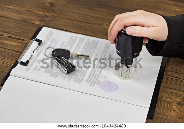 \
Buying a car,\
hand, keys, contract, seal,\
pen