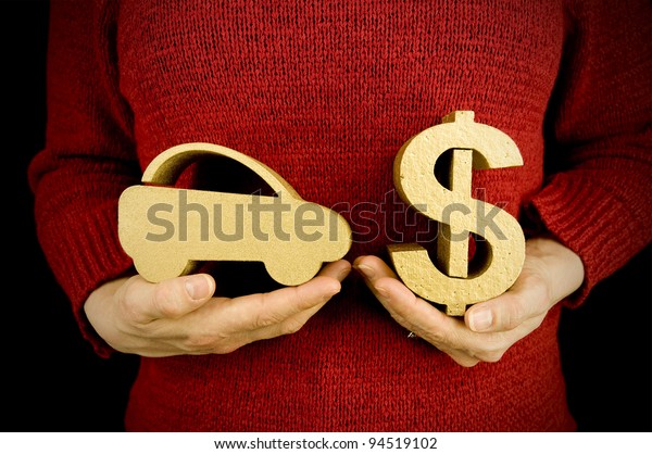 buying car, woman\
holding gold car and\
dollar
