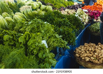 Buying Fresh Organic Produce At The Farmers' Market. Fresh Herbs On The Vendor's Counter