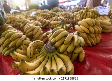 Buying Fresh Organic Produce At The Farmers' Market. Fresh Bananas On The Counter