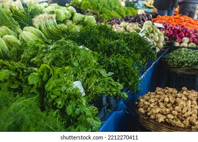 Buying Fresh Organic Produce At The Farmers' Market. Fresh Herbs On The Vendor's Counter