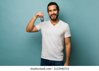 Buying My First Car. Excited Good-looking Man Receiving The Keys Of His New Car