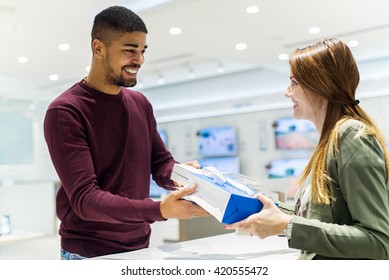 Buying New Smart Phone At Tech Shop.