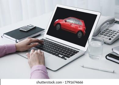 Buying Online. Woman Choosing Car Using Laptop, Closeup View