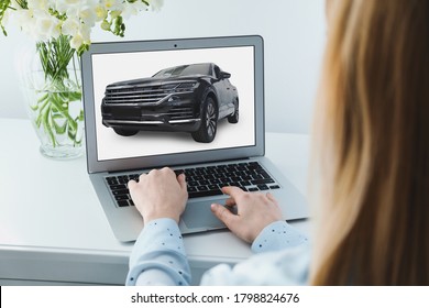 Buying Online. Woman Choosing Car Using Laptop, Closeup View