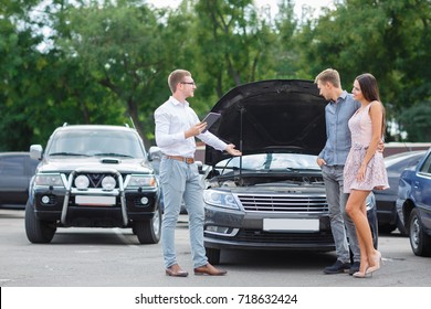 Buying Used Car. Car Dealer Inventory. Used Cars Store. Male Wants To Buy The Car. Happy Life. Summer Time. Young Family. Communication With The Seller From Auto For Sale.