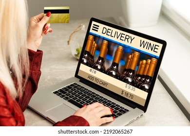 Buying Wines Online, Home Delivery Concepts. Screen Laptop Computer On Table With Wine Bottle