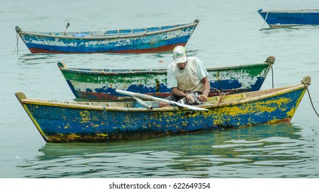 BUZIOS, BRAZIL – FEBRUARY 25, 2017: Fishing boats at anchor in the harbor of the resort city on the Atlantic coast including a dory-like boat popular with local fishermen.