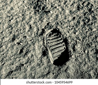 Buzz Aldrin's footprint on the moon. Astronaut's boot print on lunar moon landing mission. Moon Surface. Image of the Moon showing landing site of Apollo 11. Elements of this image furnished by NASA - Powered by Shutterstock