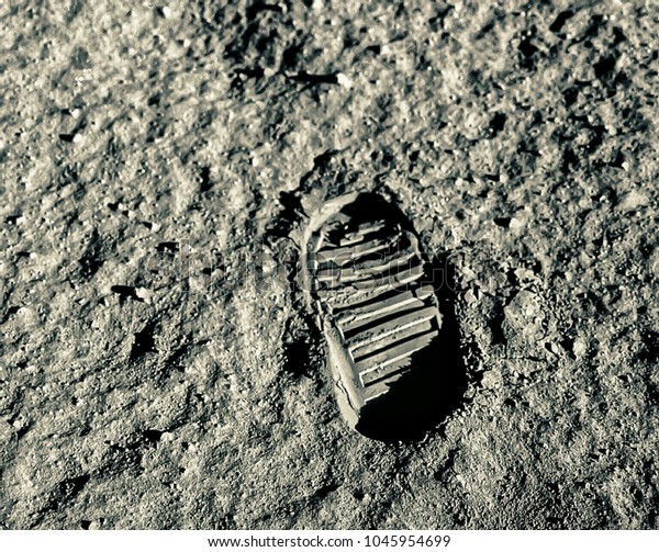 Buzz Aldrin\'s footprint on the moon. Astronaut\'s\
boot print on lunar moon landing mission. Moon Surface. Image of\
the Moon showing landing site of Apollo 11. Elements of this image\
furnished by NASA