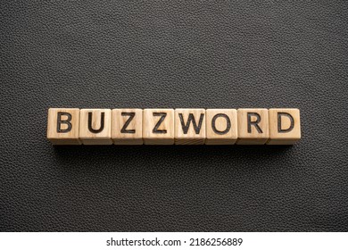 Buzzword - word wooden blocks with letters, Buzzword popular word or phrase concept, black leather background - Shutterstock ID 2186256889