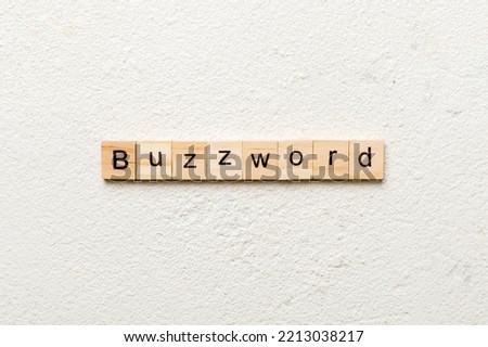 BUZZWORD word written on wood block. BUZZWORD text on cement table for your desing, concept.