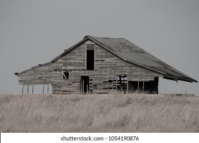 B&W abandoned rustic rural barn on open plains