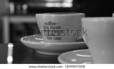 BW Coffee mug with quote on it and reflection